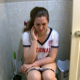 Adriana wears her sports jersey while taking a shit sitting on a toilet. She complains of cramps. Wet farts and shitting are heard. She wipes her ass thoroughly when finished. No poop is seen. Presented in 720P HD. Over 7 minutes.